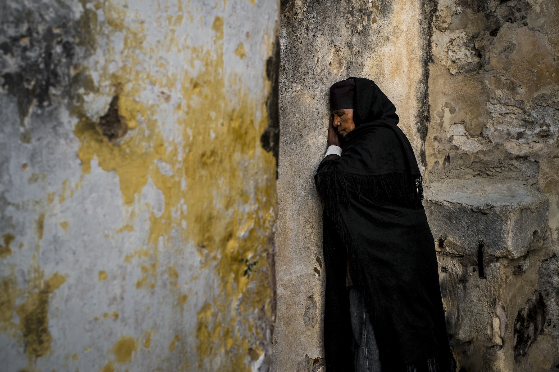a Coptic Christian prays in the Old City of Jerusalem
